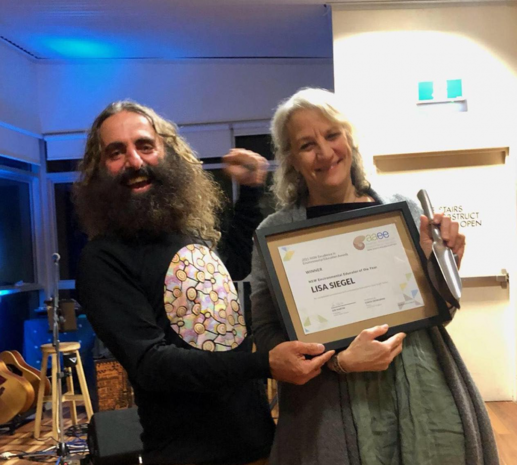 Costa Georgiadis and Lisa Siegel holding her award